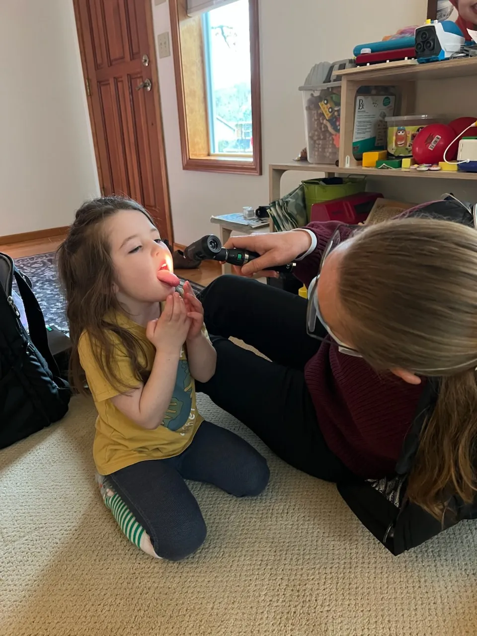 Dr. Rivers examining a child